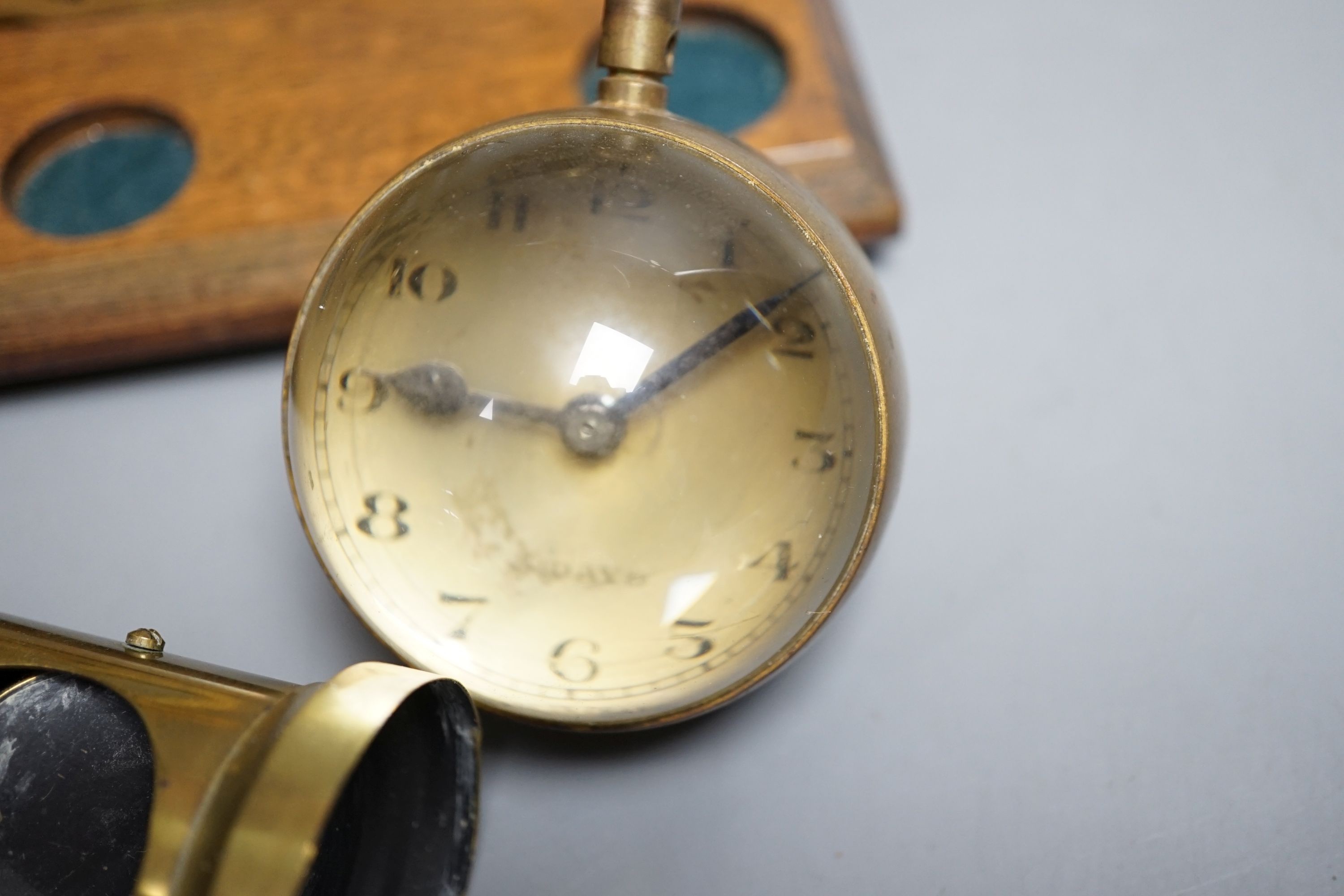 A student's brass monocular microscope, a pair of letter scales and a desk watch, Letter scales 17cms wide.